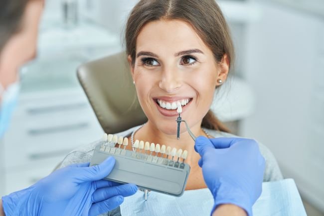 male dentist woman dental clinic choosing implant shade